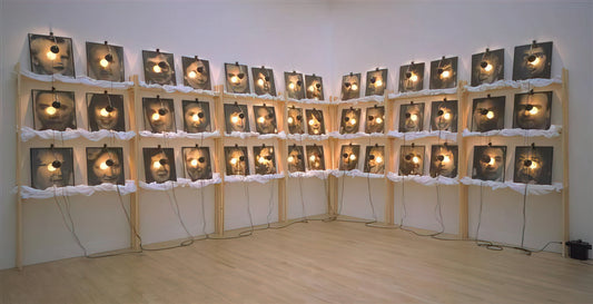 Christian Boltanski Framed Canvas Print: A Collector's Guide to His Haunting Art - THE RESERVE OF DEAD SWISS 1990 by Christian Boltanski